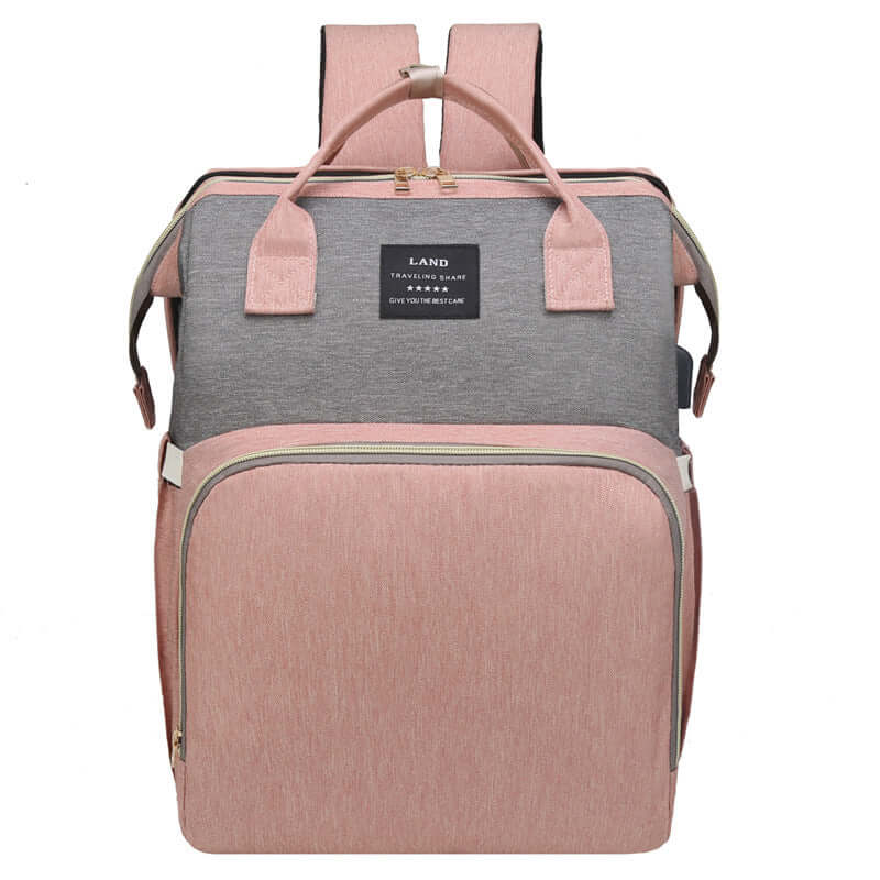 Stylish baby changing backpack with detachable crib feature, perfect for on-the-go parents.