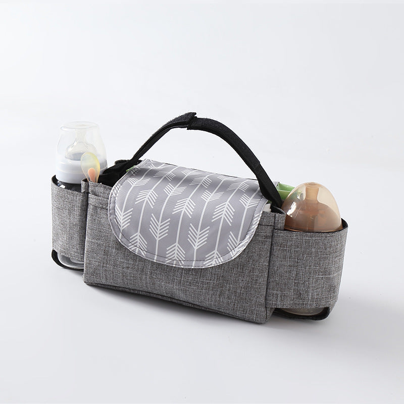 Heyoravix waterproof stroller organizer bag hanging on stroller handlebar