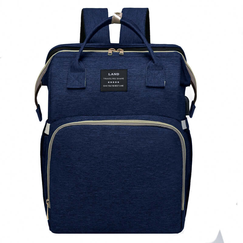baby changing backpack in navy blue color with multiple compartments for diapers and baby essentials