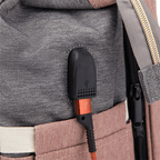 Baby changing backpack with portable crib featuring built-in USB charging port