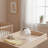 Hands-free breast pump worn inside bra for convenient pumping